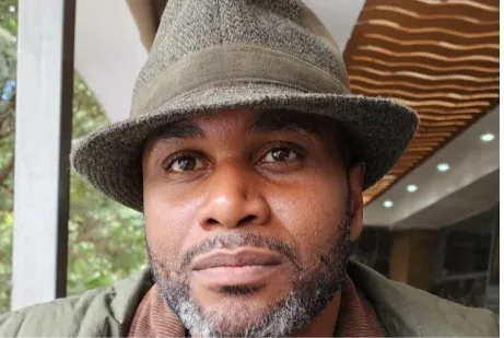 Levi James Howze in a grey hat